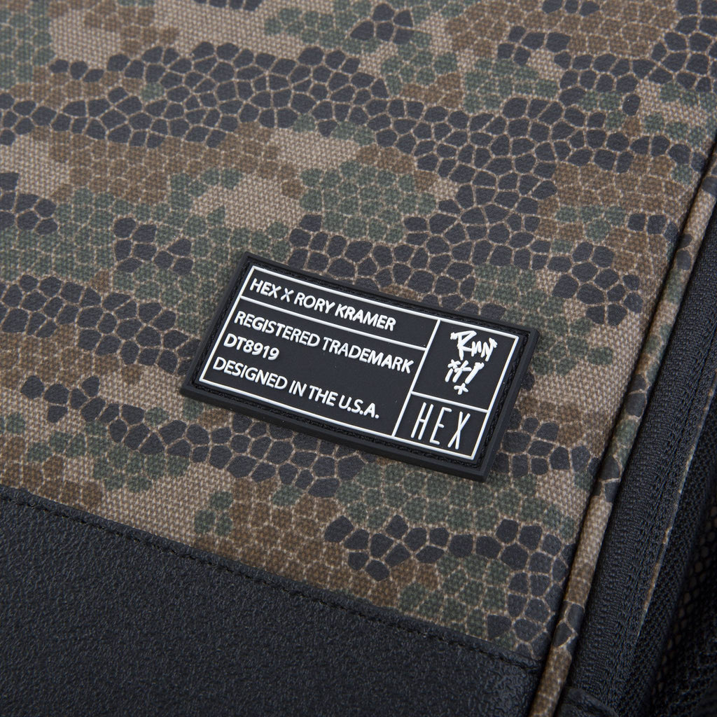 Close up of HEX x Rory Kramer Cinema Backpack, showing rubber HEX sewn-on label