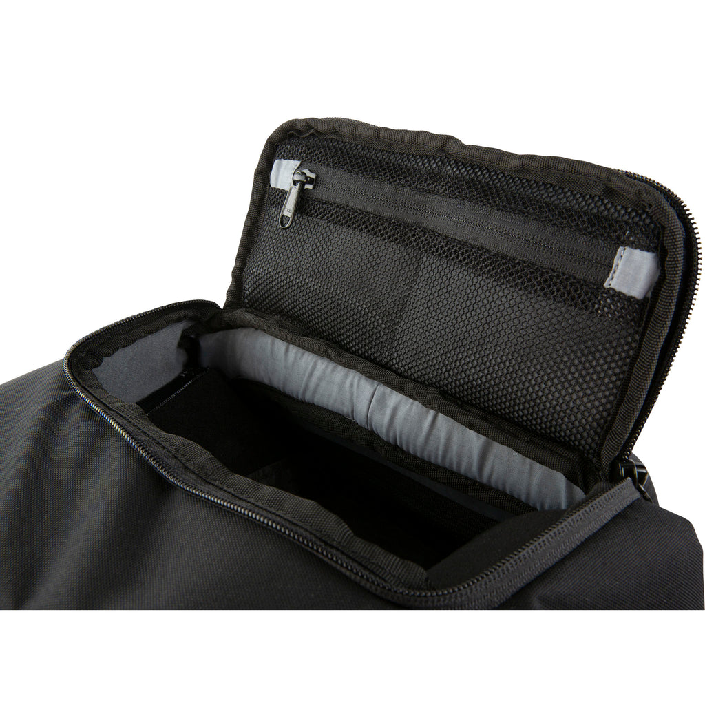 Close up view of the top zippered pocket unzipped and folded open showing two mesh zippered accessory storage pockets on the Hex Black Cinema Backpack
