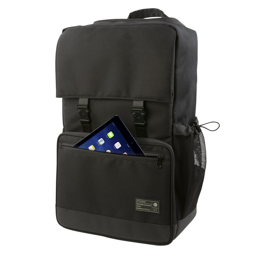 Front view of the Hex Black Cinema Backpack with the accessory zipper pocket partially open with a tablet halfway into the compartment