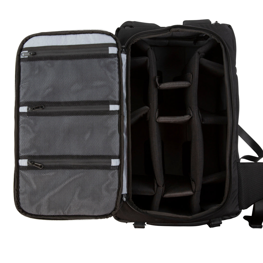 Close up view of the Hex Black Cinema Backpack with the padded back panel zipped open and folded over showing the interior with multiple padded compartments and zippered mesh sleeves for cord storage