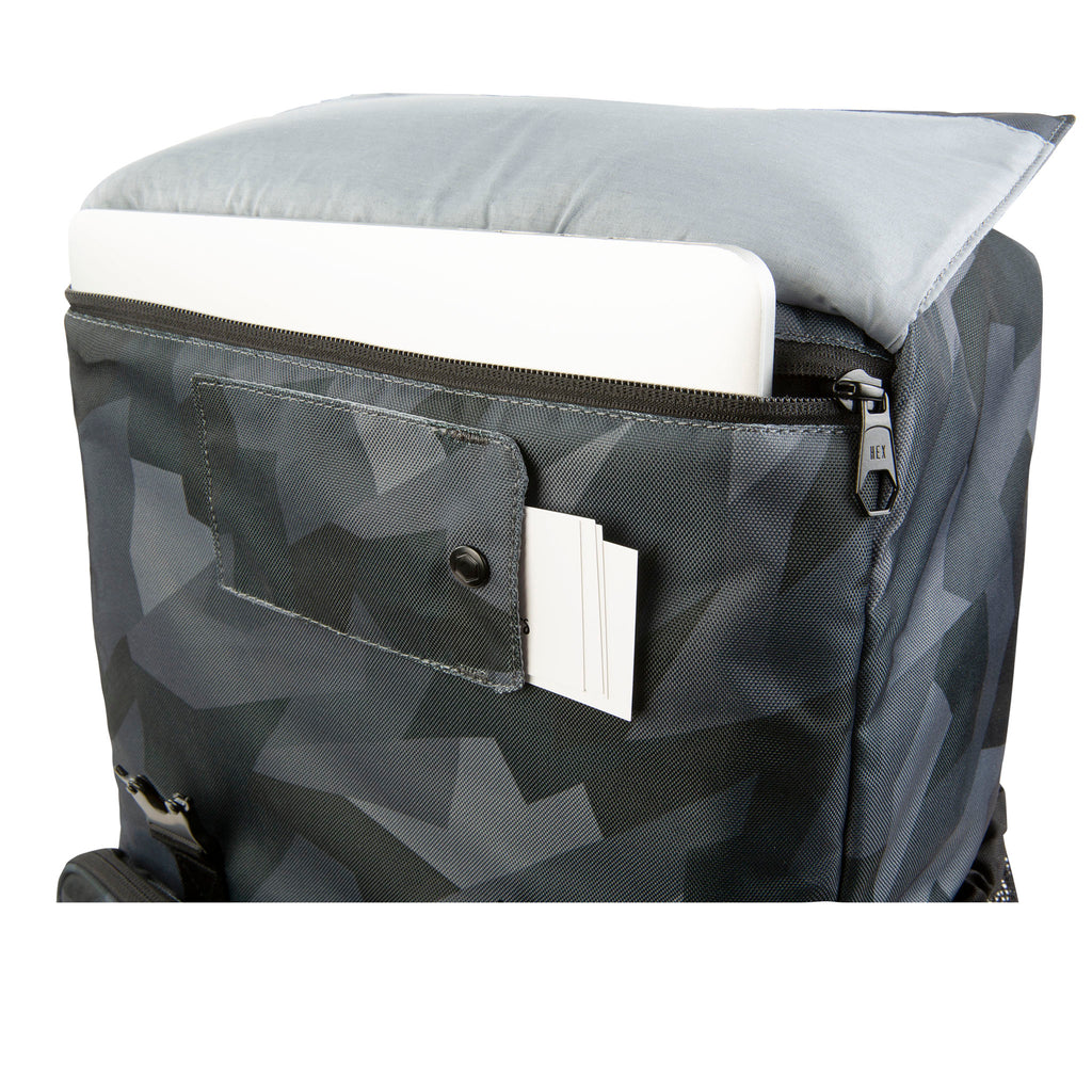 HEX Glacier Cinema Backpack, Grey Camo. Front view. Zoomed in photo of ID slot and laptop compartment. 