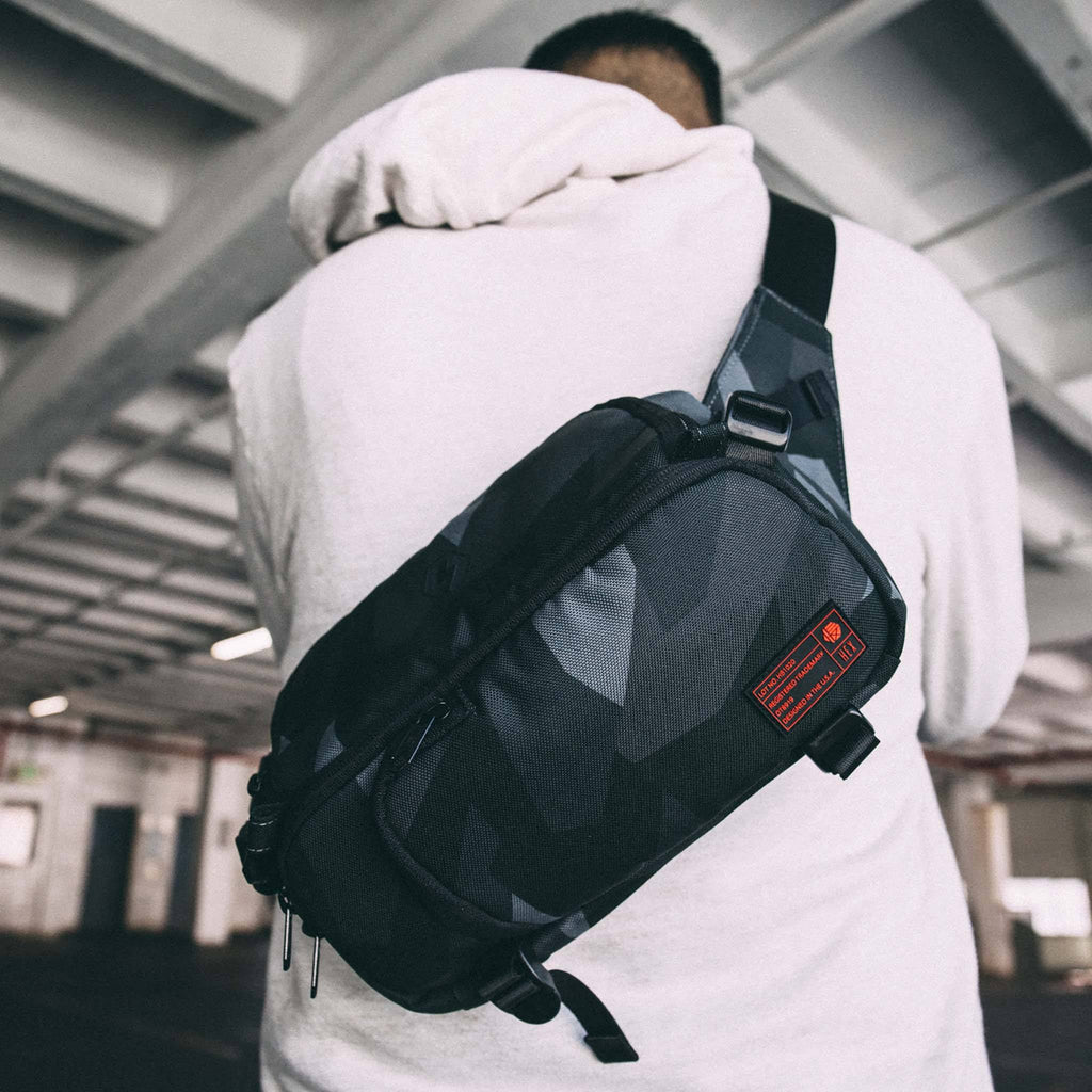 Man wearing Ranger Glacier Camo DSLR Mini Sling on his back